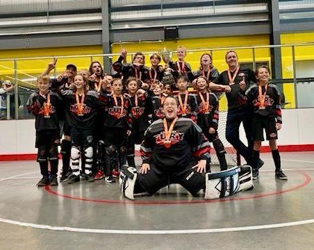 U11 Black U11 Ball Hockey Players and Coaches Group Photo after winning Goal Medels