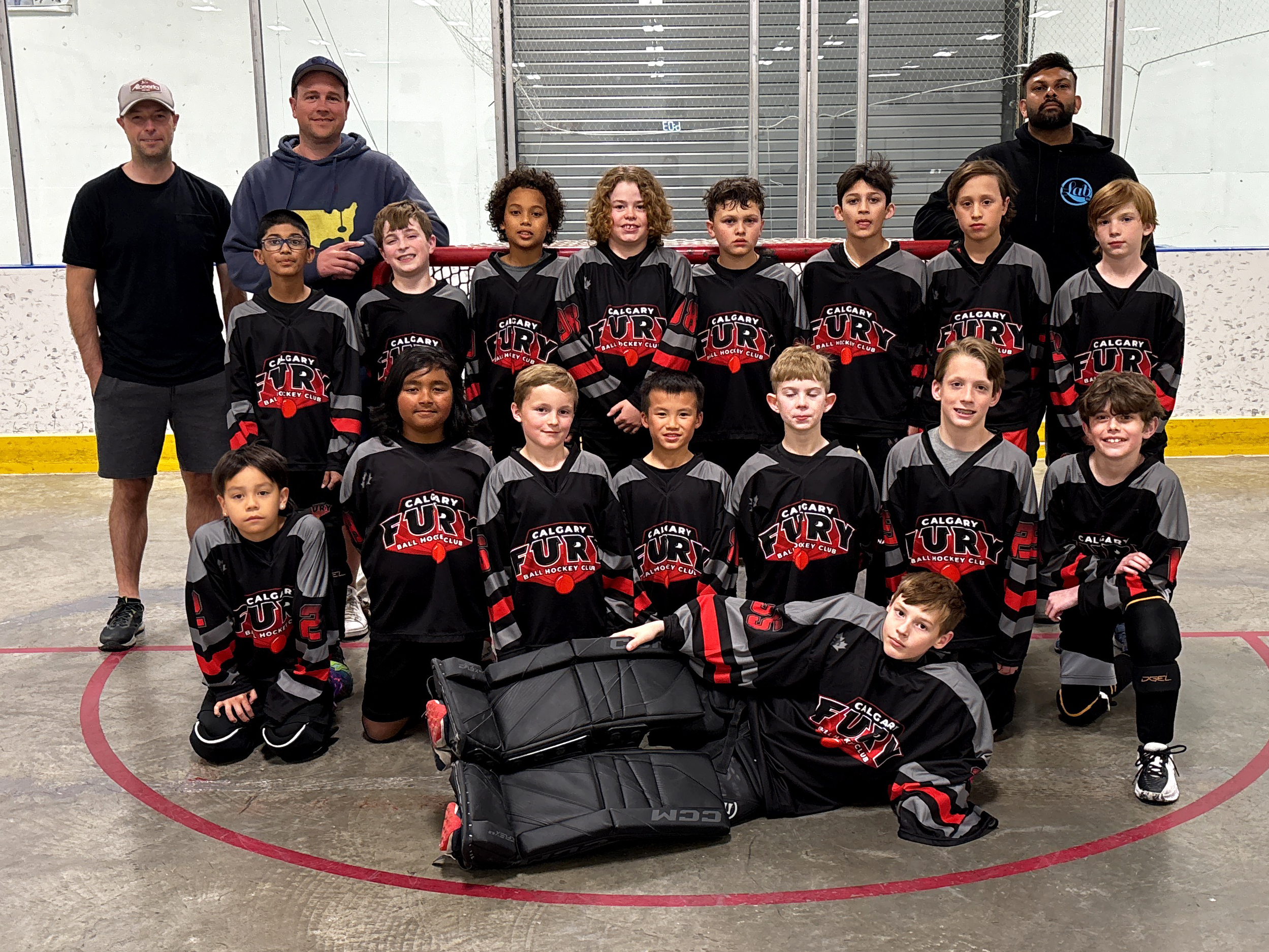 1 U11B USE U11B Team Group image of elite ball hockey players and coaches