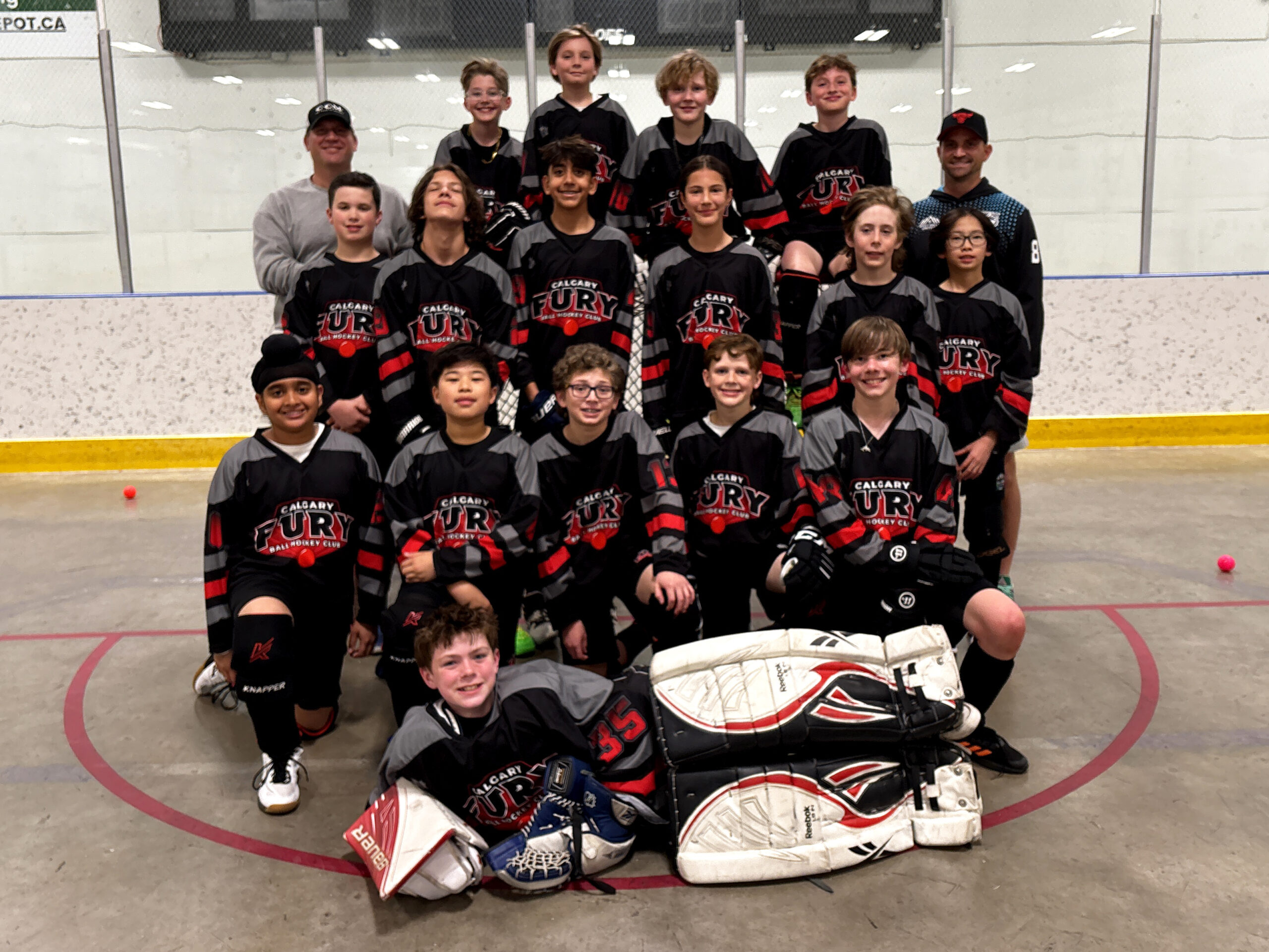 1 U13B USE U13B Team Group image of elite ball hockey players and coaches